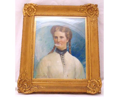A framed oil on canvas portrait of a young lady with pigtails indistinctly signed bottom left, 52 x 43cm