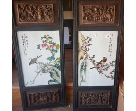 Pair Chinese decorated ceramic panels in carved wood frames