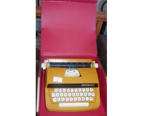 A mid-century portable typewriter by Petite International