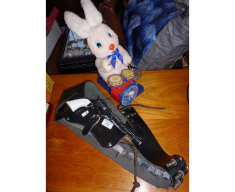 Vintage tinplate SON A1 Toys Duracell Bunny automaton (A/F), and a Remington toy pistol in holster