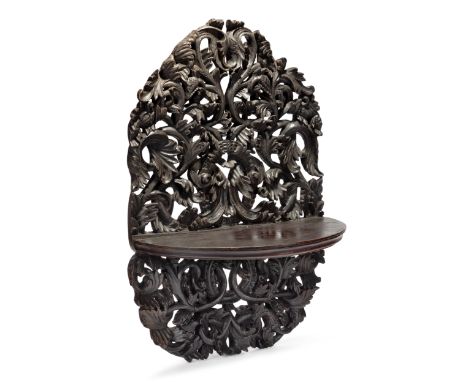 A Dutch colonial dark wood openwork floating shelf,Batavia or Maritime South Asia Dutch possessions, circa 18th century and l