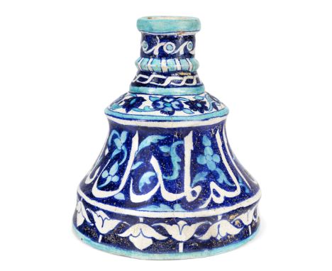 An Iznik style blue and white pottery candlestick,Multan, Punjab, Eastern Pakistan,Possibly meant as a huqqa base, on plain b