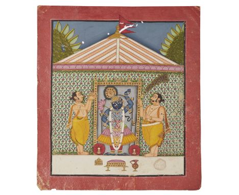 The worship of Sri NathjiNathdwara, North India, circa 1860The bare chested and bejewelled blue skinned deity standing in a s