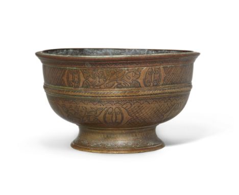 An unusual footed bronze bowl, Deccan, India, 18th century, on a splayed foot, with rounded sides and narrow everted lip, eng
