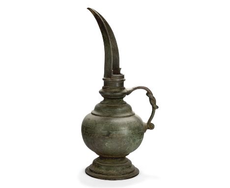 An inscribed cast bronze pouring vessel,Tamil Nadu, South India, circa 15th/16th centuryOn splayed foot, the body rising to a