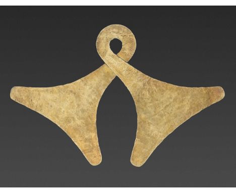 Indonesia, Western Sumba, 19th century or earlier. The gold pectoral of classic double axe-head form.Provenance: Dr. Borwen L