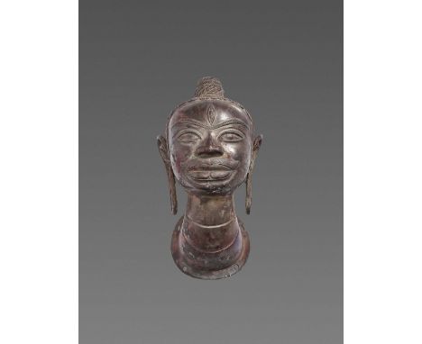 Champa, 10th-12th century. The head displaying the classic iconography of Shiva, the central deity of the Cham people, with l