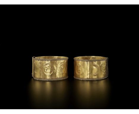 Indonesia, 19th to early 20th century. The open bangles with fine repoussé showing various images such as two human figures, 