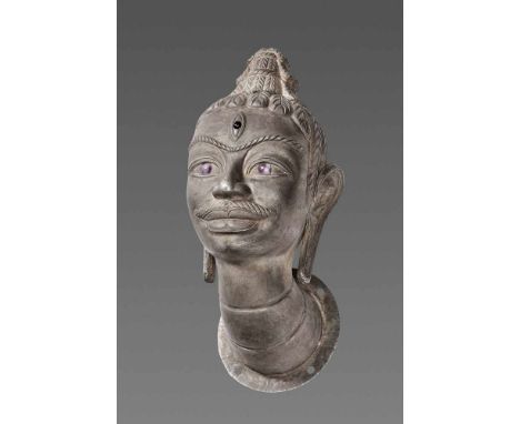 Champa, 10th-12th century. The head displaying the classic iconography of Shiva, the central deity of the Cham people, with l