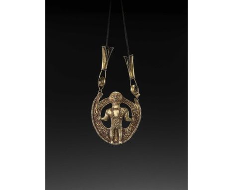 Indonesia, Tanimbar, 18th-19th century. The pendant finely executed in repoussé with a depiction of Atuf, the solar hero and 