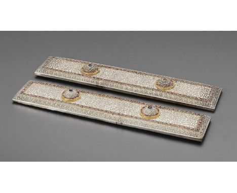 Sri Lanka, 1900-1920. The manuscript covers of rectangular form, crafted from silver with gold accents, set with innumerable 