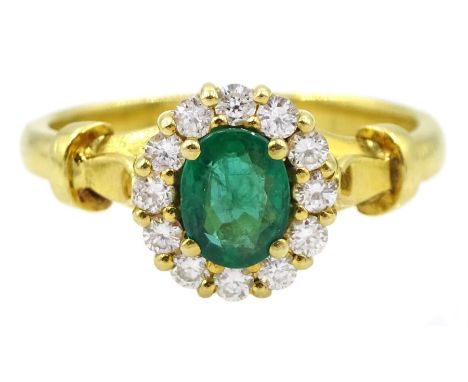 18ct gold oval emerald and round brilliant cut diamond cluster ring, stamped 750Condition Report:Approx 4.15gm, size k-L, ove