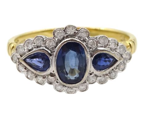 18ct gold three stone pear and oval cut sapphire ring, with diamond surroundCondition Report:Approx 3.05gm, tested 18ct, size