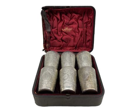 Set of six Victorian engraved silver tumbler cups with oval cartouches and gilded interiors, each H7cm in original case Sheff