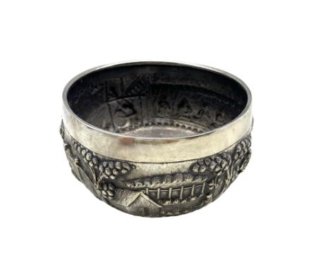 19th century Chinese white metal bowl, repousse decorated with a continuous scene of figures and buildings in a landscape, ce