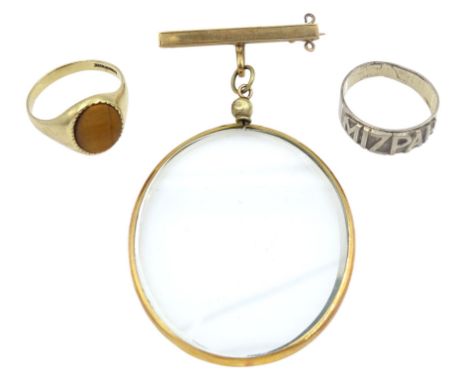 Early 20th century 9ct gold glass portrait frame brooch, 9ct gold tigers eye ring and a Victorian silver 'Mizpah' ring, Birmi