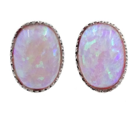 Pair of silver oval opal earrings, stamped 925Condition Report:Max diameter = approx 9mm, good condition 