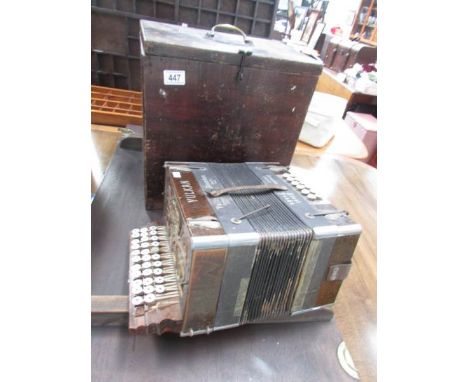 A boxed piano accordion.