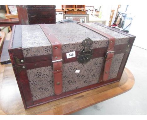 A leather bound trunk.
