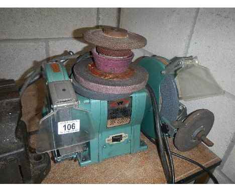 An electric bench grinder and discs.