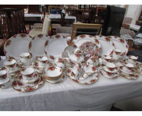 Approximately 60 pieces of Royal Albert Old Country roses tableware including teapot, cake stand, platters etc,