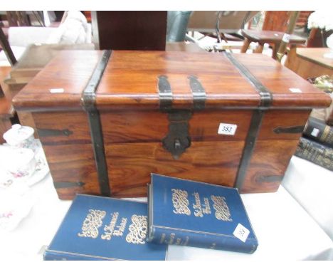 A wooden metal bound trunk.