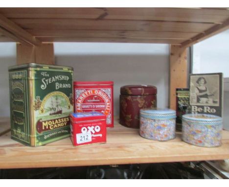 A shelf of old tins and boxes.