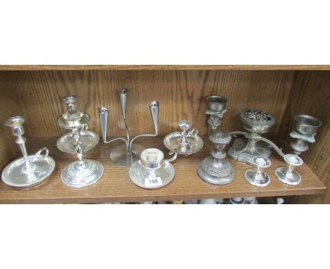 A mixed lot of candlesticks and candelabra.
