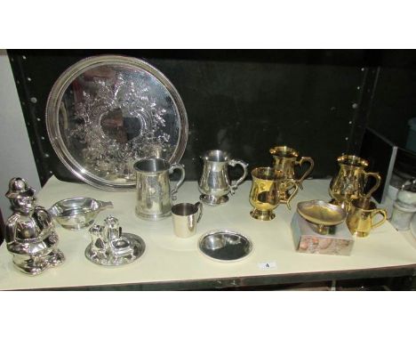 A shelf of silver plate, brass and pewter items etc.,