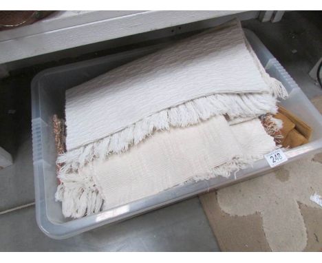 A box of assorted textiles.