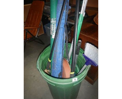A green bin containing tools.