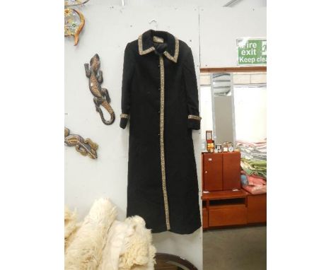 An Alexon young set by Alanah Tandy full length black coat with embroidered edges.