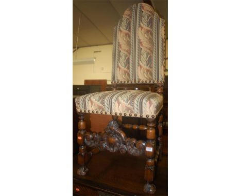 A walnut framed Caroleon style bright floral tapestry upholstered, and further studded high backed single dining chair 