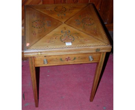 An Edwardian faded mahogany chequer banded and floral polychrome painted envelope card table, having revolving action and sin