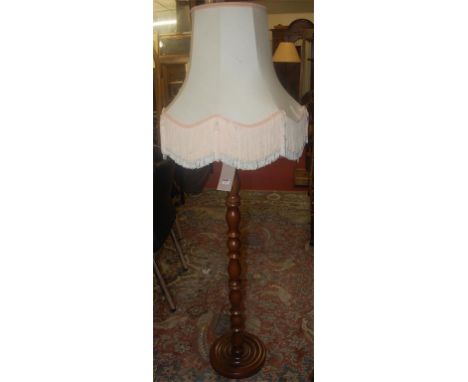 A contemporary hardwood standard lamp 