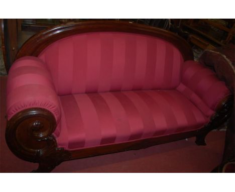 A contemporary Continental mahogany framed and red striped upholstered three seater sofa, having floral scroll carvings, w. 2