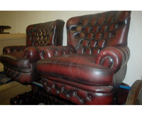 A contemporary ox-blood leather buttonback and further studded three piece Chesterfield suite, comprising; three seater sofa 