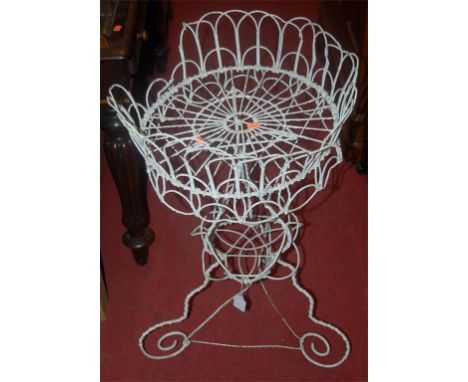 A Victorian white painted wirework garden planter of circular form