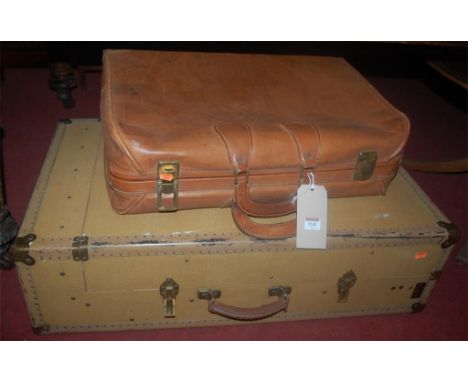 A canvas and metal bound travelling trunk; together with a tan leather and metal bound suitcase (2) Condition Report / Extra 