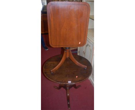 A George III provincial oak circular tilt-top tripod table; together with an early 19th century mahogany round cornered tilt-