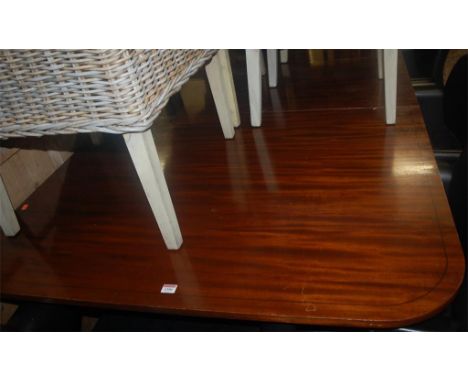 A Regency style mahogany round cornered twin pillar dining table, having two extra drop-in leaves, length 300cm 