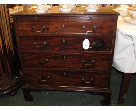 A George III mahogany chest of four graduated drawers with brush slide on bracket feet with brass swan neck handles. Height 8