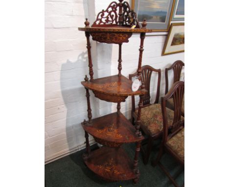 Victorian walnut four-shelf corner what-not, bow fronted with twisted supports and finials, the shelves inlaid with urn and f