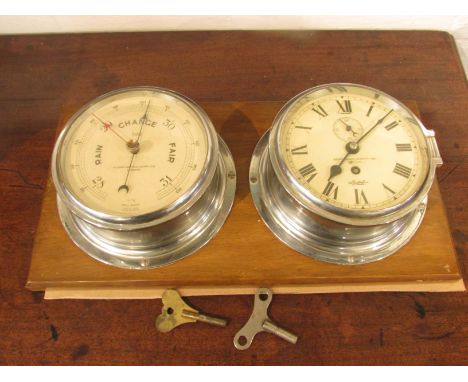 A Sestrel Marine Nautical Supplies London bulkhead barometer and a Marine Nautical Supplies London 'Sestrel' Trade Mark bulkh