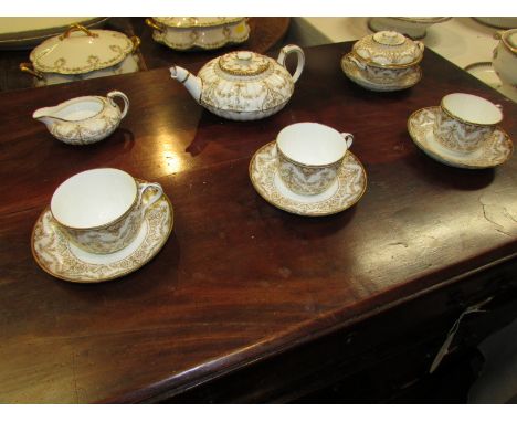 Wedgwood part tea service fluted and gilded comprising teapot (a/f), sucrier, creamer, three cups and four saucers