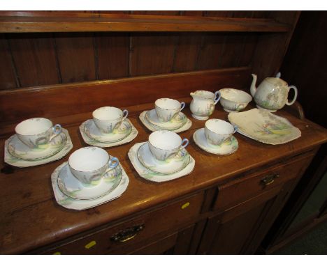 Shelley China tea set, garden pattern IS 094 15, comprising six cups and saucers, five tea plates, a cake plate, tea pot, sug