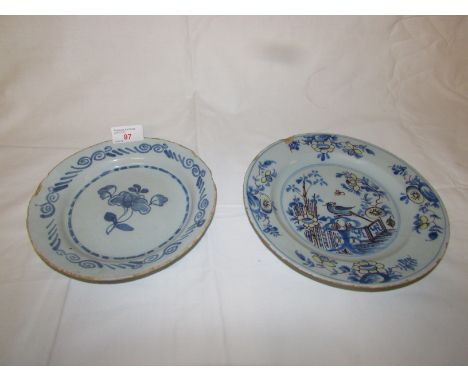 Two 18th century tin glazed earthenware plates - the first 19.5cm diameter, blue and white, painted with flower and a loop an