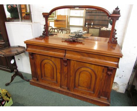 Victorian serving sideboard, the mirrored back on carved scrolled supports, two drawers to the frieze, the two cupboard doors