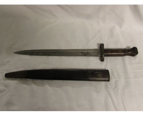 A bayonet in sheath, the blade stamped MOLE 7 01, to the other side arrow mark, crown, B 35 X, length including handle 42cm