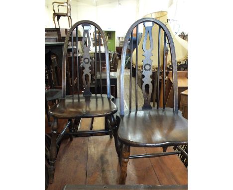 A set of six elm dark Ercol style dining chairs